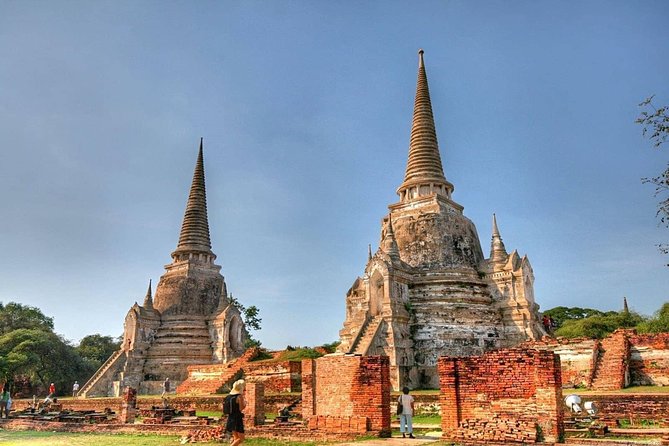 Afternoon Ayutthaya heritage site & River Boat Ride at Sunset - What the guide adds to the ruins