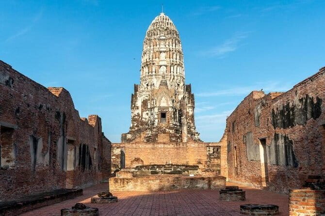Ayutthaya Bicycle Tour with Scenic Boat Experience - Wat Mahathat and the Buddha in the banyan roots