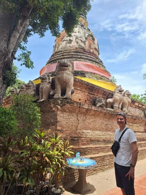 Ayutthaya: Colorful Slow Life Bicycle Tour with local guide. - Wat Mahathat and the Buddha in the tree roots