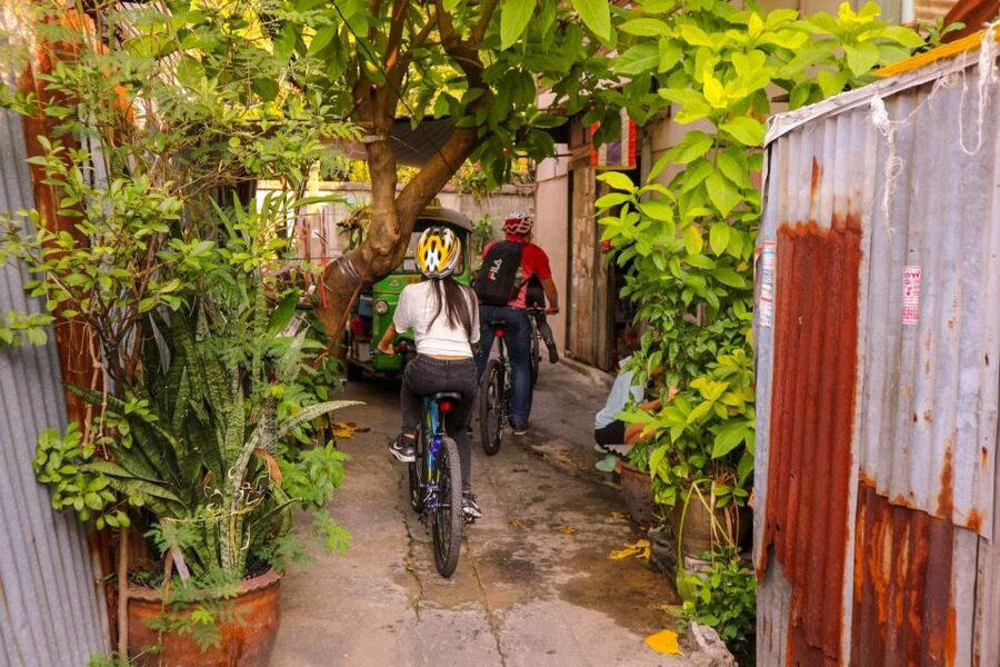 Bangkok: Bike and Canal Boat Tour with Lunch - Loading the bikes onto a long-tail boat