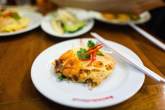Bangkok by Night: Temples, Markets and Food Tuk-Tuk Tour - Local snacks in the Wongwian Yai area