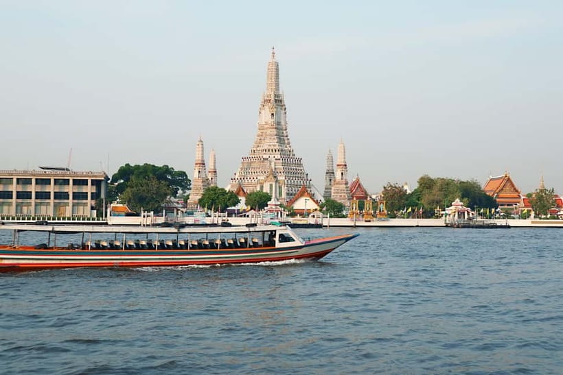 Bangkok: Canal Tour, River Local Life & Wat Arun Guide Visit - Reading Bangkok from a teak boat
