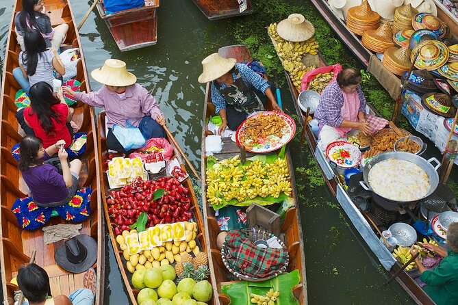 Bangkok: Floating Market and Train Tour with Guide in Spanish and English - Maeklong Railway Market and the moving stalls