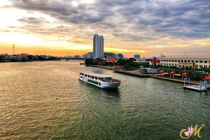 Bangkok Manohra Cruise Sunset Dining on Chao Phraya River - Wat Kanlayanamit and the quieter riverbank