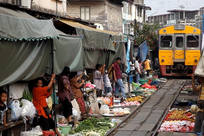 Famous Markets Tour: Maeklong Railway & Damnoen Saduak Floating - Maeklong Railway Market and the famous train passage