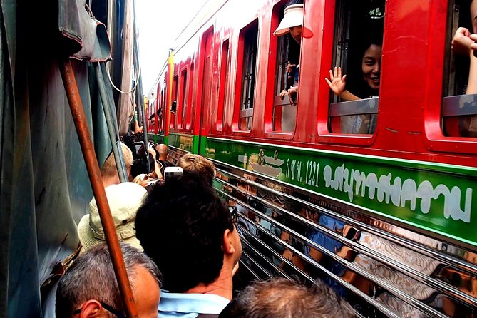 Floating & Railway Market and Coconut Farm Tour [Optional Luxury] - The train through Mae Klong Market