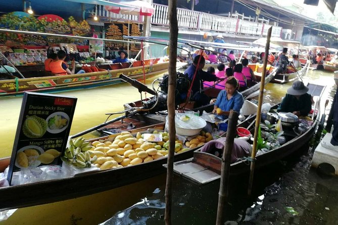 Full-Day Floating Market and Maeklong Railway Market Private Tour from Bangkok - The train that cuts through Maeklong Market