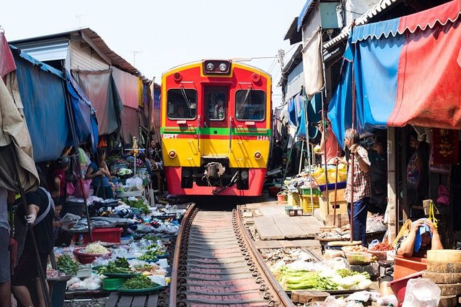 Full-Day Floating Market and Maeklong Railway Market Private Tour from Bangkok - Two temples that slow the day down
