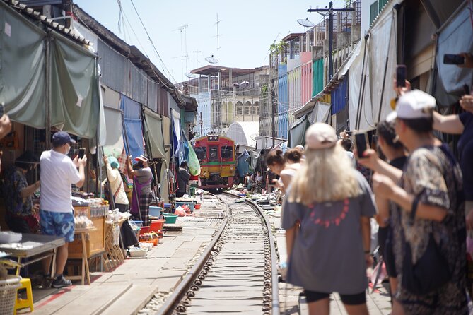 Maeklong Railway Market and Floating Market - Damnoen Saduak brings boats and colorful stalls