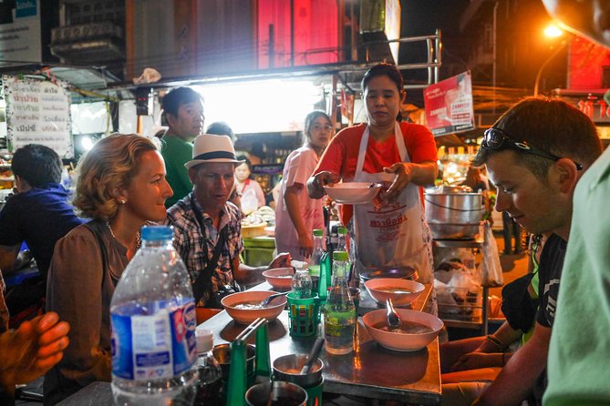 Night Street Food Tour of Bangkok's Chinatown - Stop five: rolled noodles, pepper soup, and crispy pork