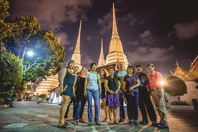 Private Bangkok Night City Tour by Tuk-Tuk with Thai Food - Wat Arun lit up beside the river