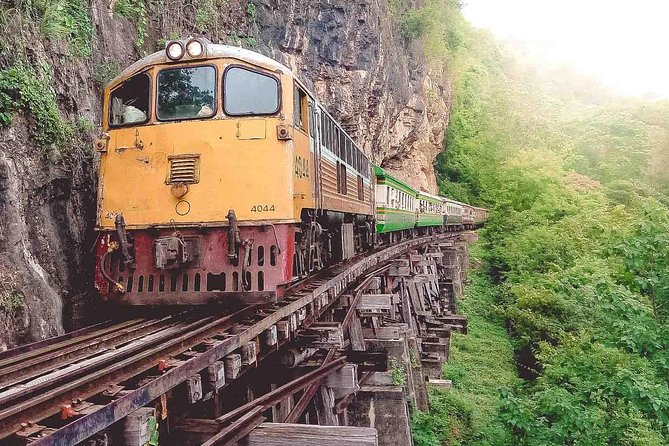 Private Tour: Death Railway, Hellfire Pass and Erawan Waterfall - Walking the Death Railway near the river