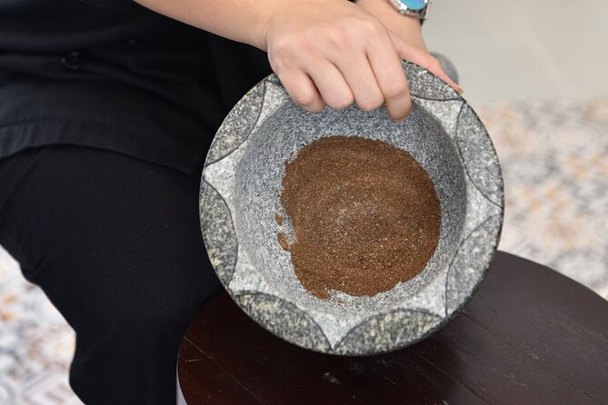 Thai Cooking Class with Market Tour in Sathon Bangkok - Preparing curry paste from scratch